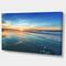 Designart - Blue Seashore with Distant Sunset - Seascape Canvas Art Print